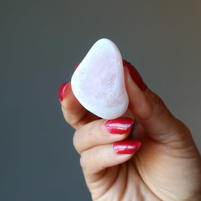 hand holding rose quartz picture windows