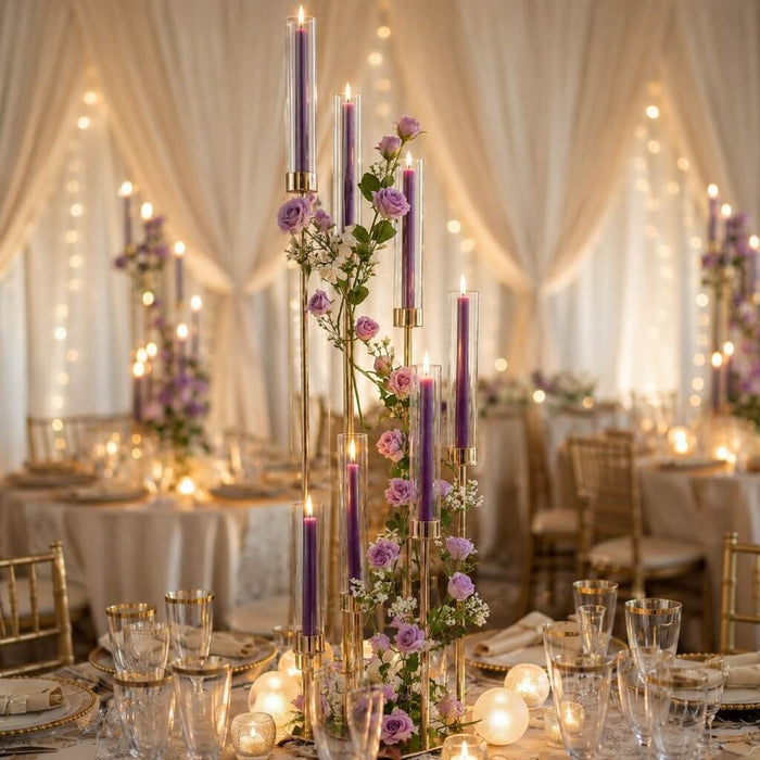Tall purple taper candles with roses on formal banquet table