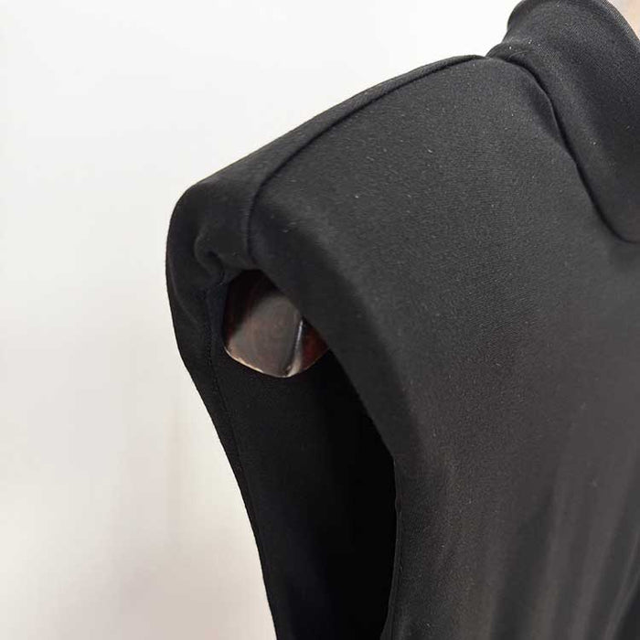 Close-up of a sleeveless long sheath evening dress showcasing the sleek shoulder design