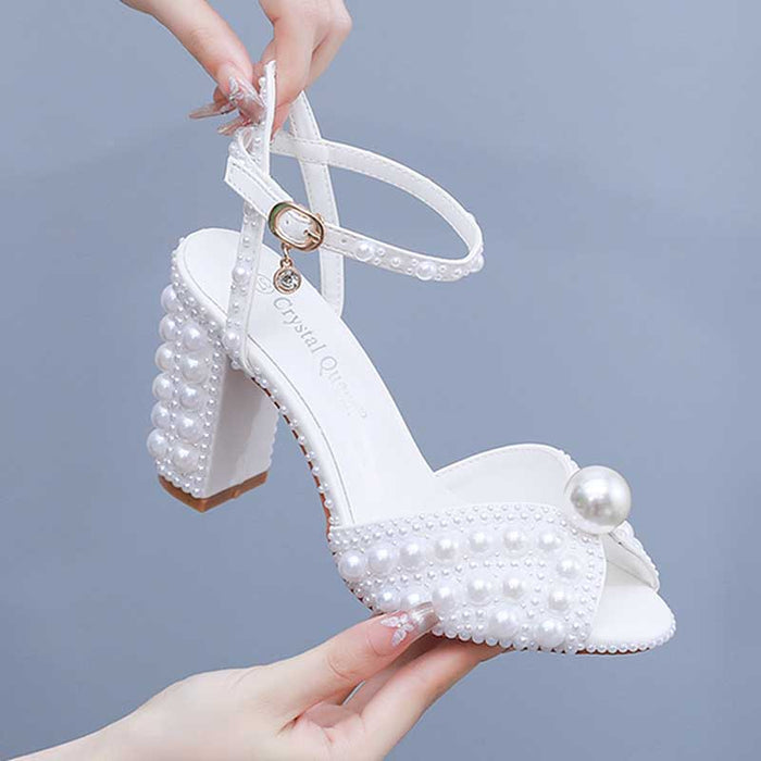White chunky wedding sandals with pearl embellishments and ankle straps from S&DCo.