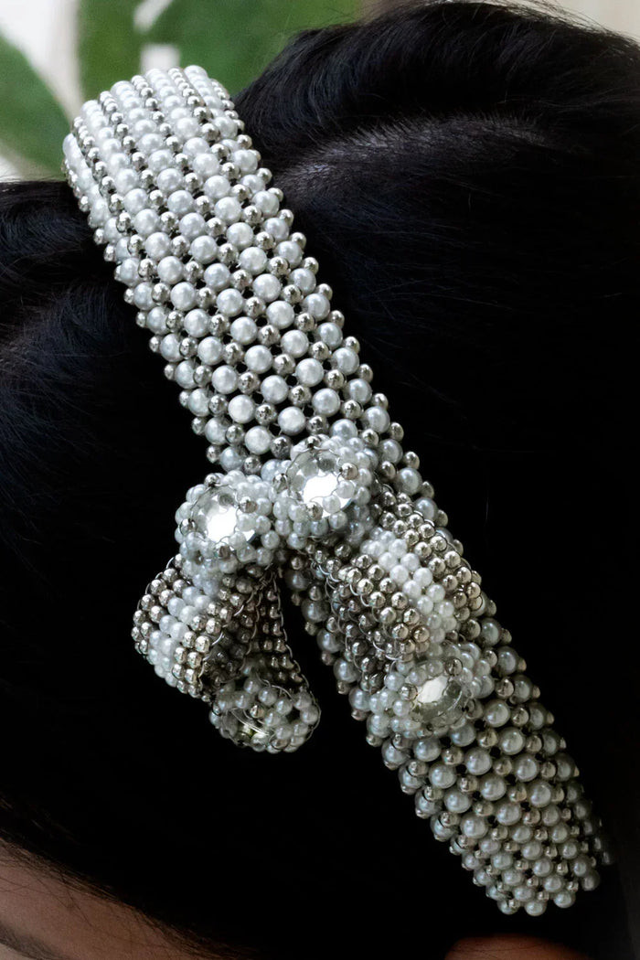 woman in black outfit wear handcrafted beaded modular headband with trinity medallion by object and dawn close up beads