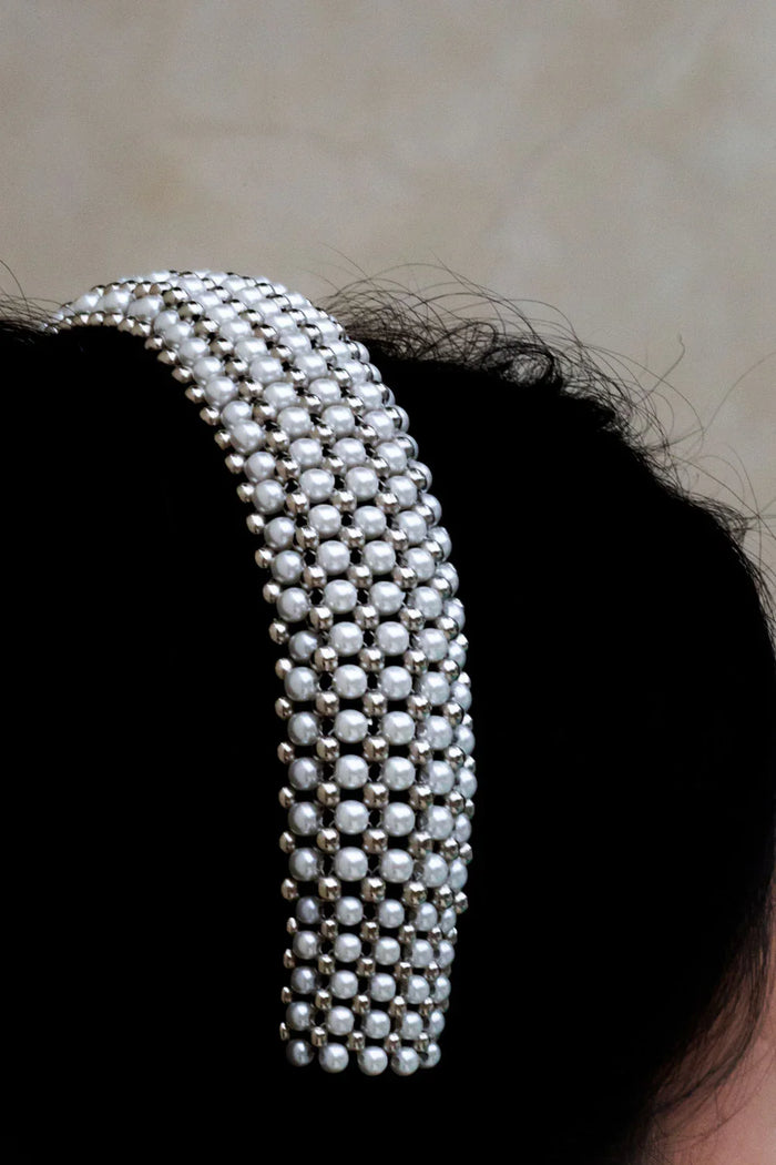 Object & Dawn Teuta Headband silver detail view worn by woman in neutral background