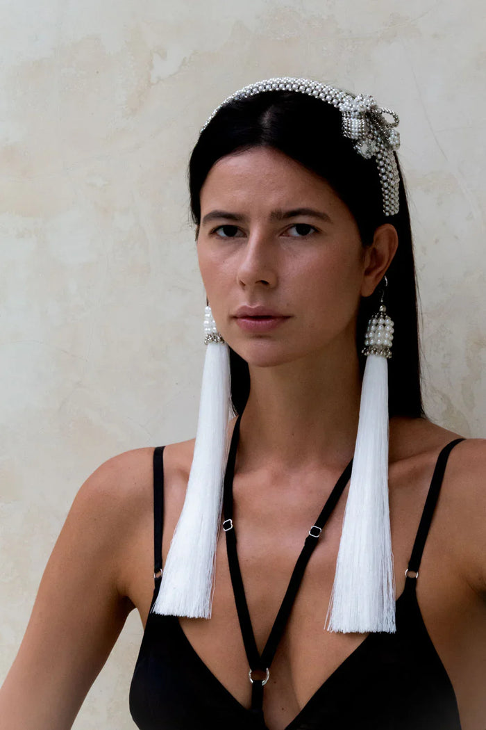 woman in black outfit wear handcrafted beaded modular headband with trinity medallion by object and dawn front