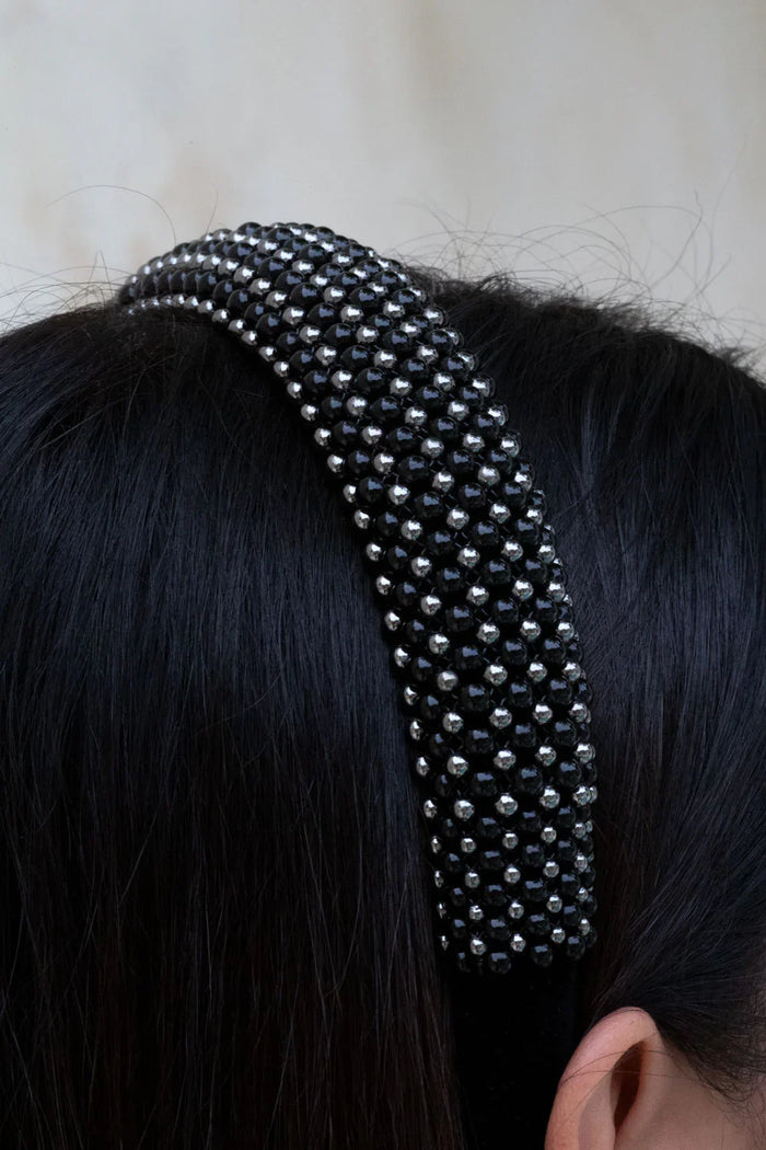 Silver beaded  with black crystals Teuta headband by Object & Dawn worn by a person with a neutral background
