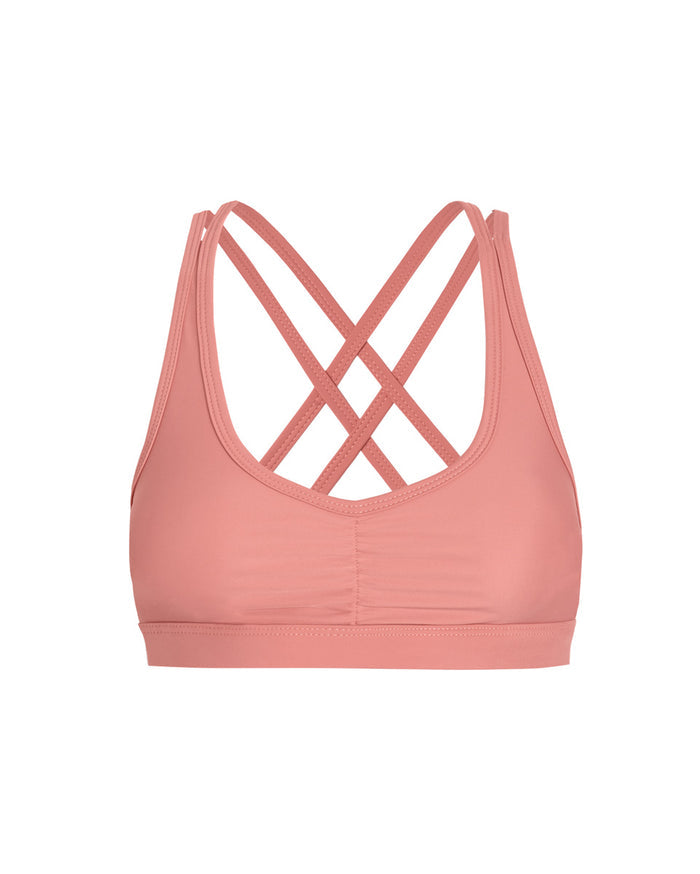 front of crossback sports bra in guava pink color