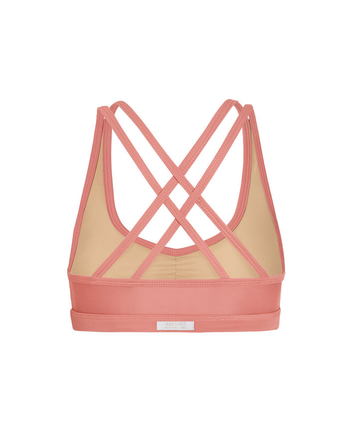 back of crossback sports bra in guava pink color