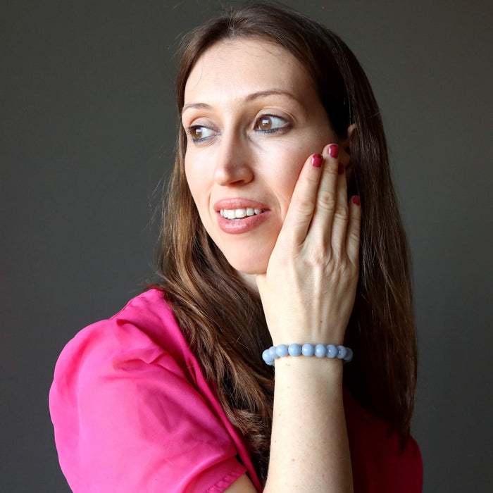 holly of satin crystals wearing blue angelite round beaded stretch bracelet