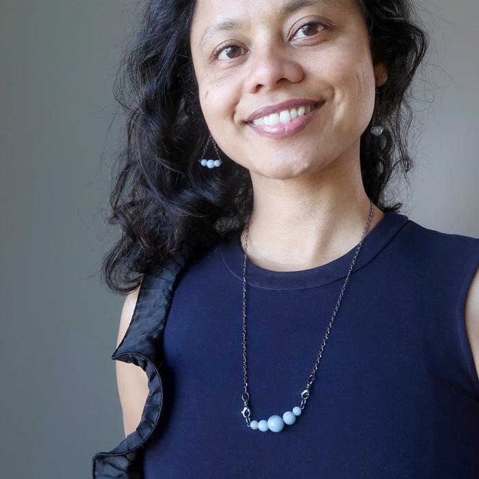 sheila of satin crystals wearing angelite cloud necklace and earrings