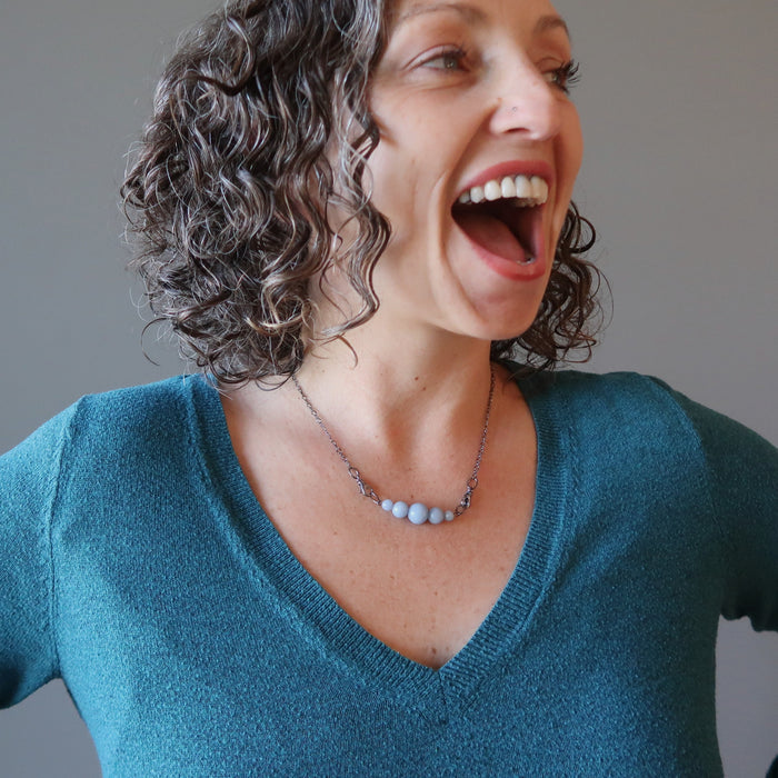 aleks of satin crystals wearing angelite cloud necklace