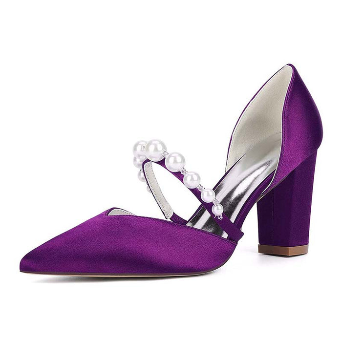 Purple high-heeled shoes with pearl embellishments on a white background