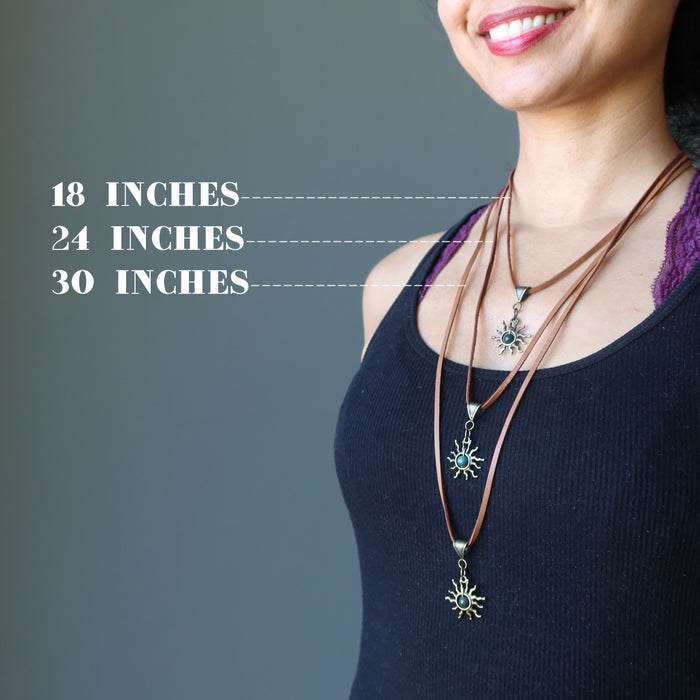 sheila of satin crystals wearing three bloodstone sun necklace on leather cords to show different lengths
