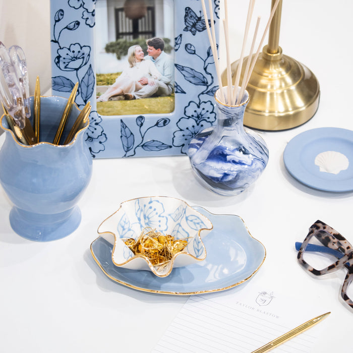 Blue Blossom Chinoiserie Ceramic Picture Frame — French Blue frame holding a separate photograph among separately sold pottery; Susan Gordon Pottery