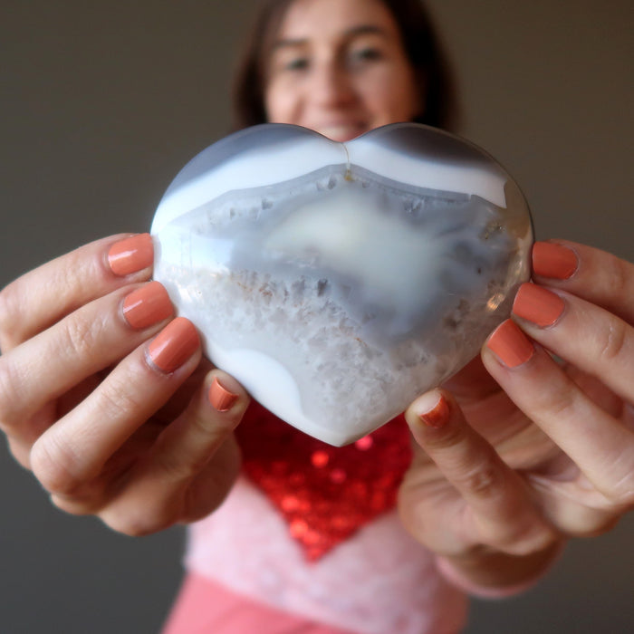 female model holding Blue Lace Agate Heart