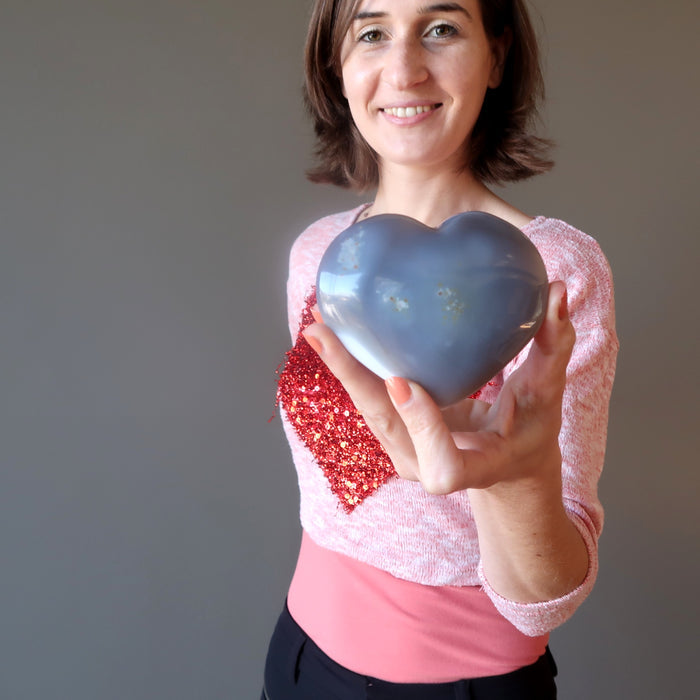 female model holding Blue Lace Agate Heart