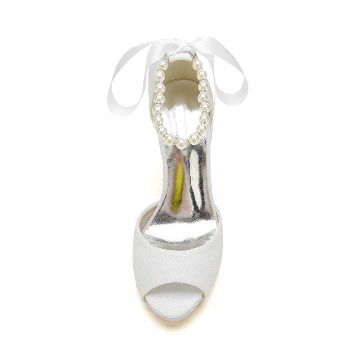 Elegant bridal shoes with pearls and ribbon in a stylish open-toe design