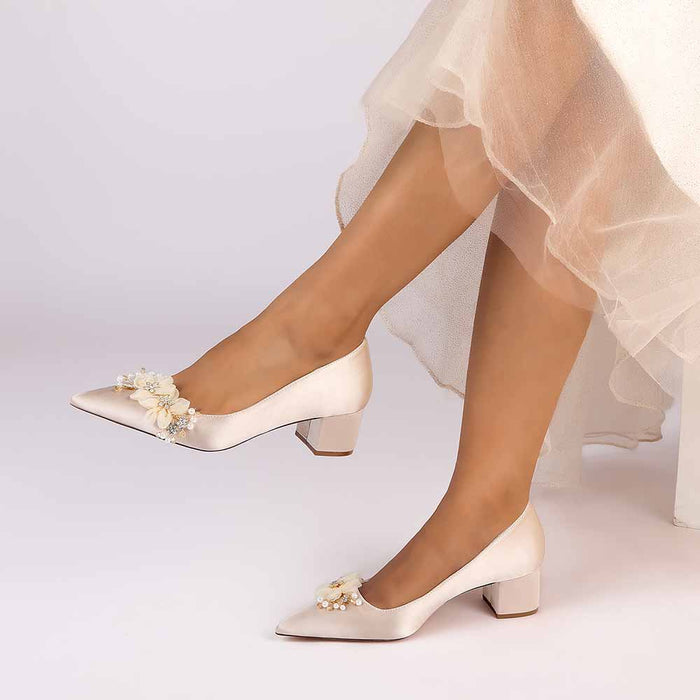 Elegant bride shoes with flower appliques in satin finish, perfect for weddings and special events