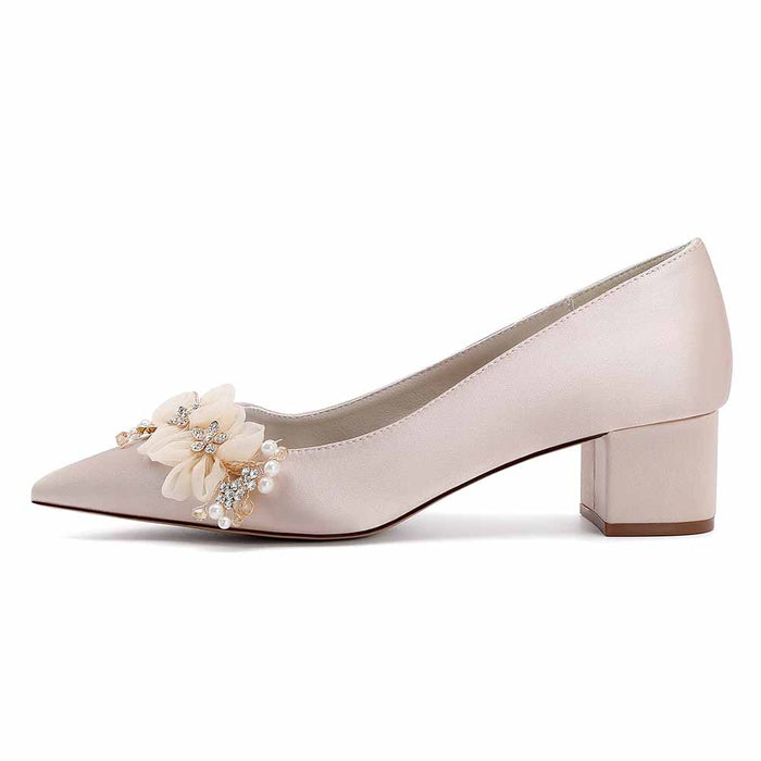Elegant bride shoes with flower appliques in soft pink and block heel for bridal celebrations