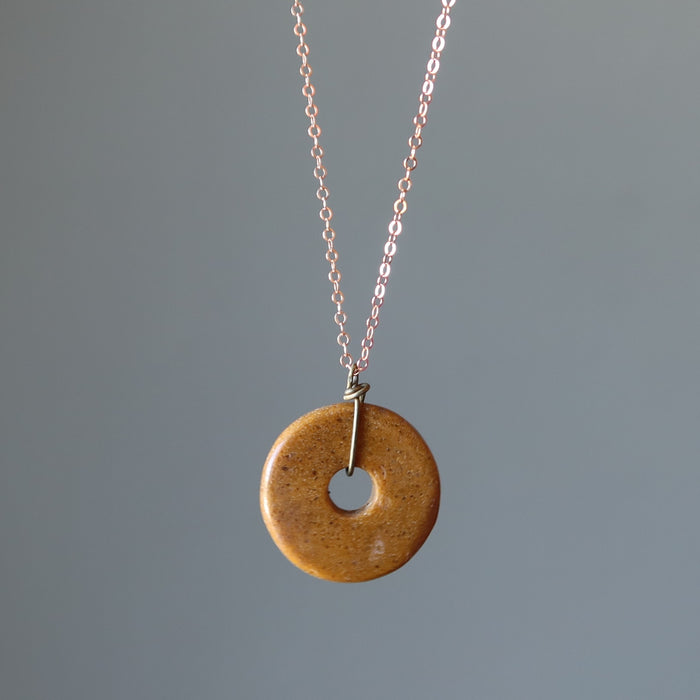 displaying the pendant and part of the necklace
