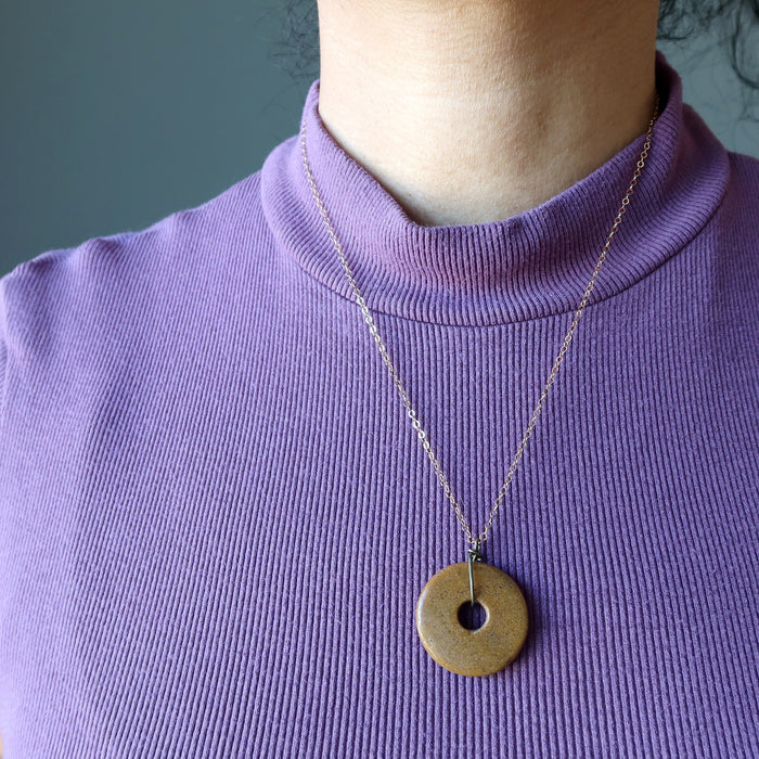 model wearing Brown Jasper Donut Amulet on 14k Rose Gold necklace