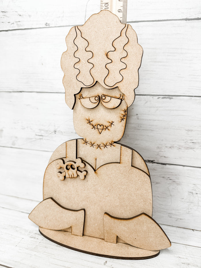 Assembled unfinished Bride of Frankenstein wooden shelf sitter DIY kit with layered hair, dress, and shoes