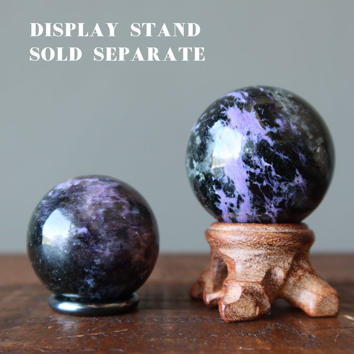 two Purple Charoite Spheres displaying on the stands