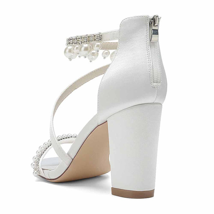 Elegant S&DCo. white heels with pearl detailing, perfect as shoes for wedding ceremonies