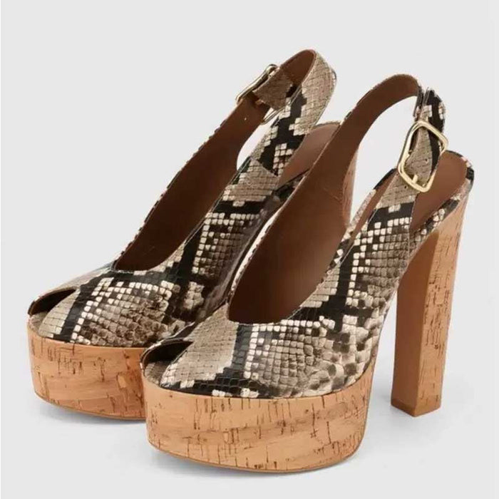 A pair of women's slingback platform high heels with a beige, brown, and black snakeskin pattern on the uppers, cork-look platform and block heels, and gold-tone buckle details, shown against a light gray background.