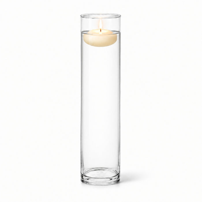 A 4"x17" clear glass cylinder vase containing a burning floating candle