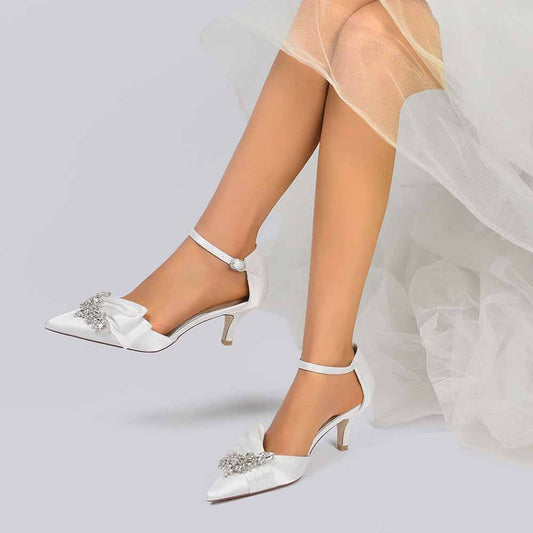 Elegant TC bridal shoes for the bride featuring a satin finish and decorative embellishments