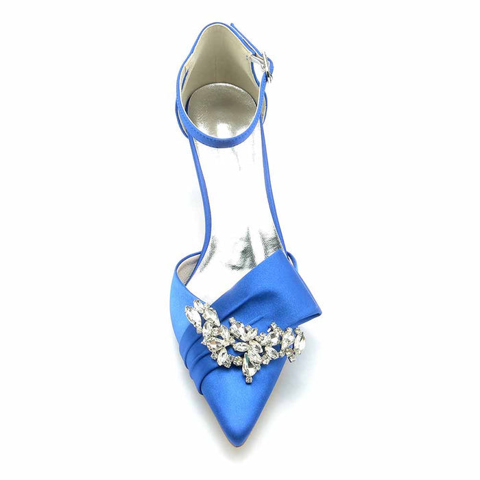 Elegant blue bridal shoes for the bride featuring a jeweled embellishment and sleek pointed toes