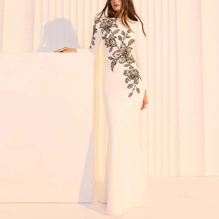 Elegant embellished evening gown for prom featuring floral embroidery and a sleek fit