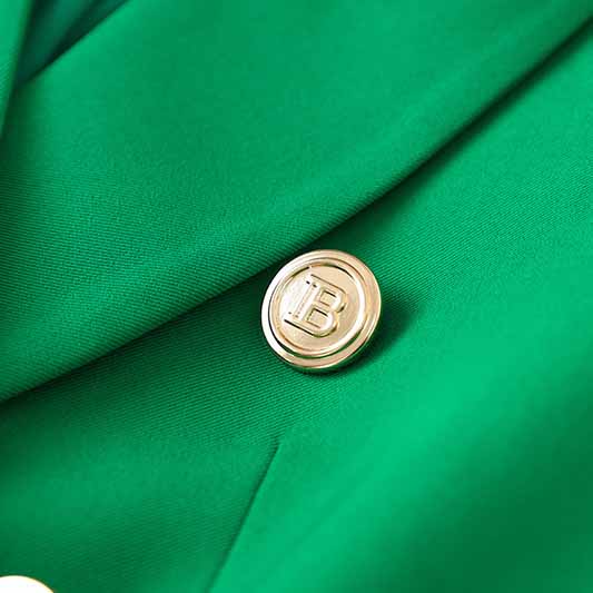 Emerald green blazer for women featuring a stylish button detail and smooth fabric texture