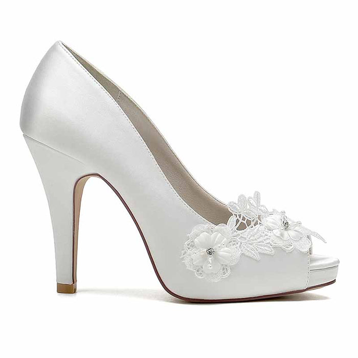 Flower lace bridal heels in white satin with floral embellishments for elegant weddings