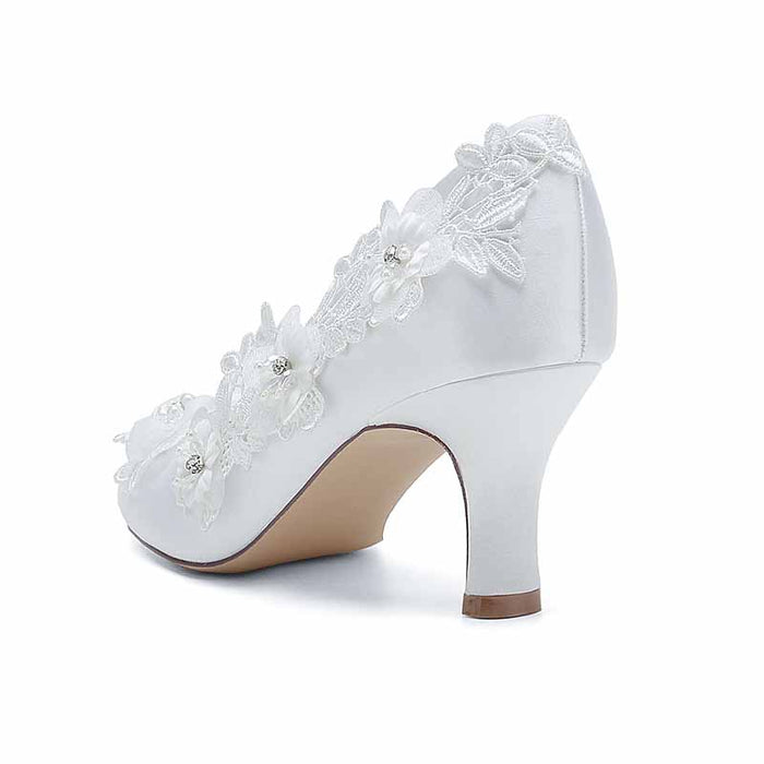 Flower lace bridal shoes in white with decorative floral details and a modest heel