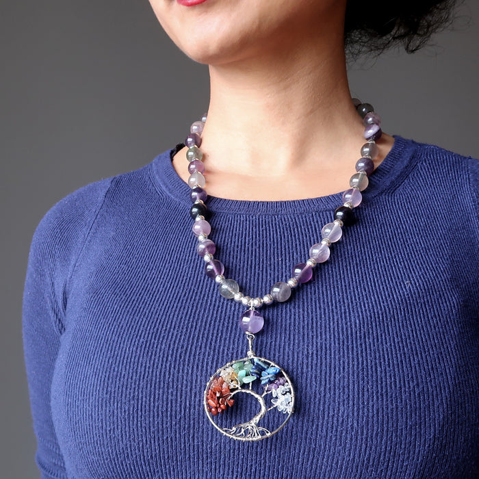 sheila of satin crystals wearing the rainbow fluorite chakra tree of life necklace