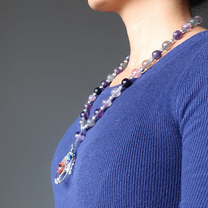 sheila of satin crystals wearing the rainbow fluorite chakra tree of life necklace