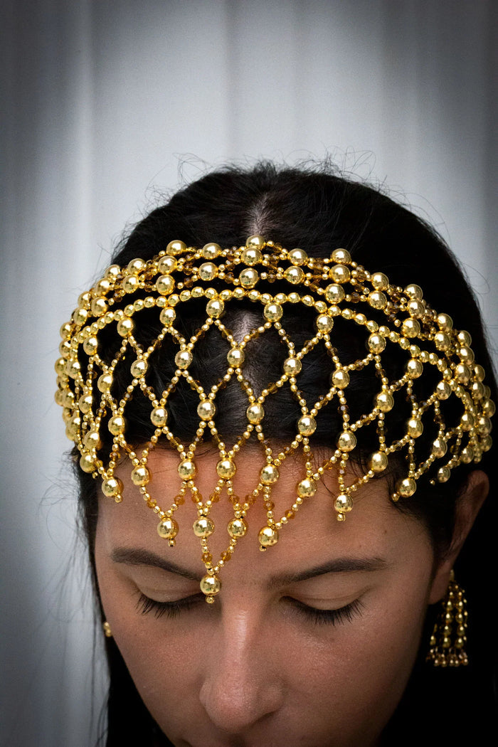 close up handcrafted modular beaded headband by object and dawn with 22k gold wash
