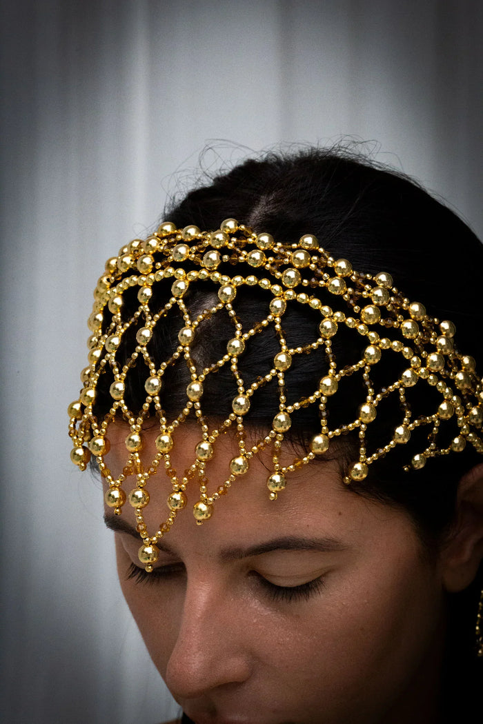 handcrafted modular beaded headband by object and dawn with 22k gold wash close up side view