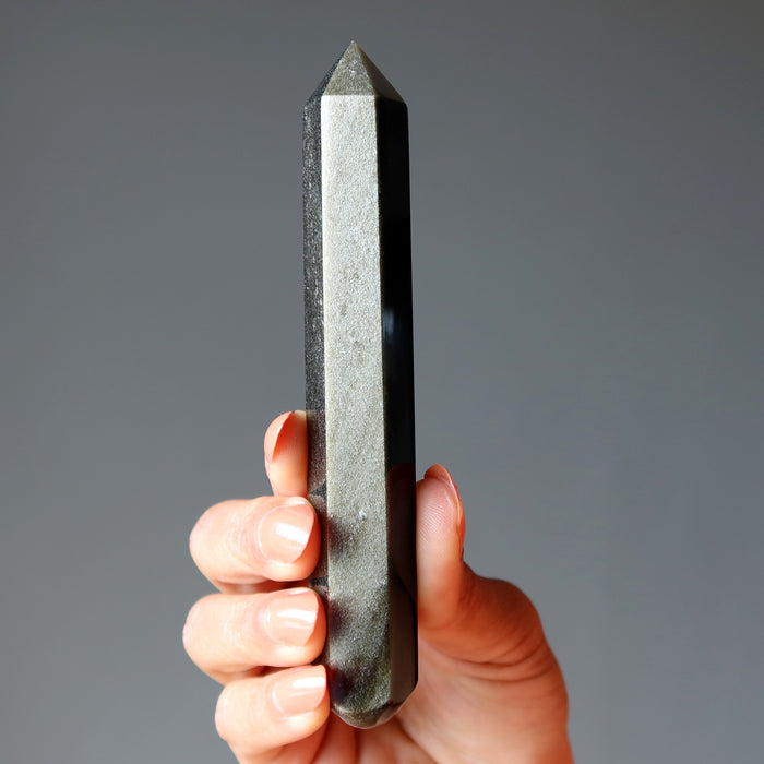 hand holding Faceted Gold Sheen Obsidian Wand