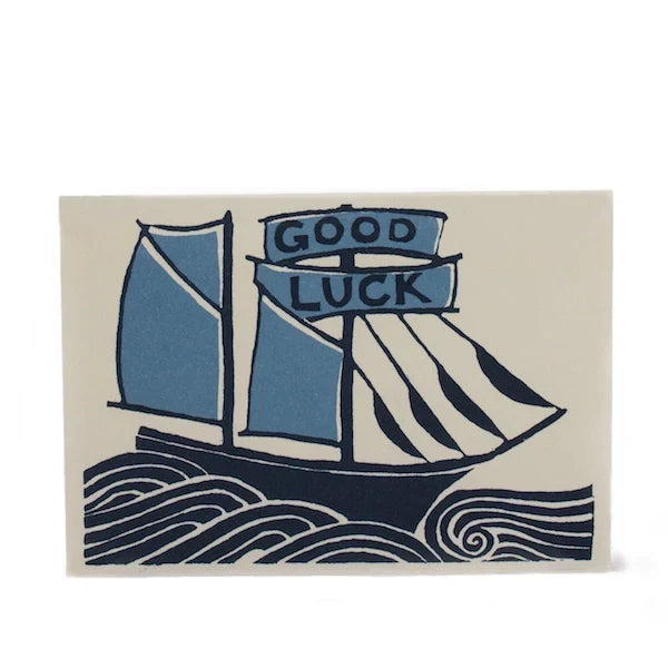 Card with a sailboat design and 'Good Luck' text on a beige background