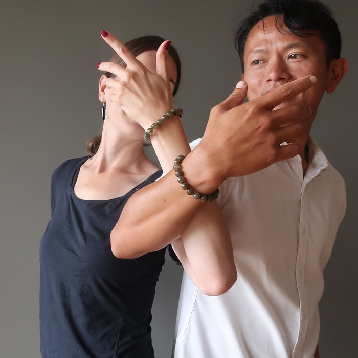 lucia and tim of satin crystals arms linked both wearing round labradorite beaded stretch bracelets