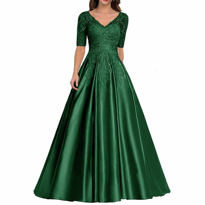 Elegant green mother of the bride satin dress with lace detailing and a flowing skirt
