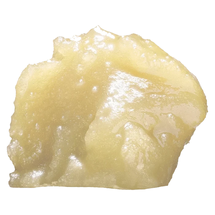 Close-up of the Naked Live Diamond Hash, showing a textured, golden-brown substance against a plain white background.