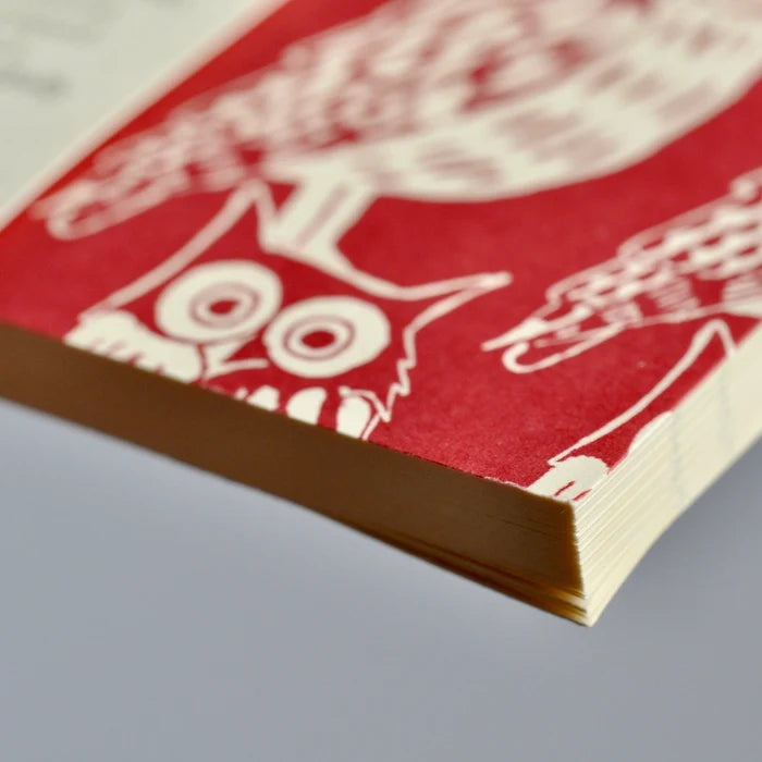 Red and white illustration of an owl on a textured surface