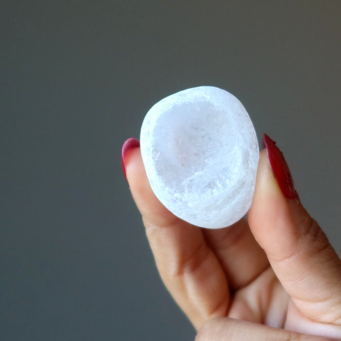 hand holding clear quartz picture windows