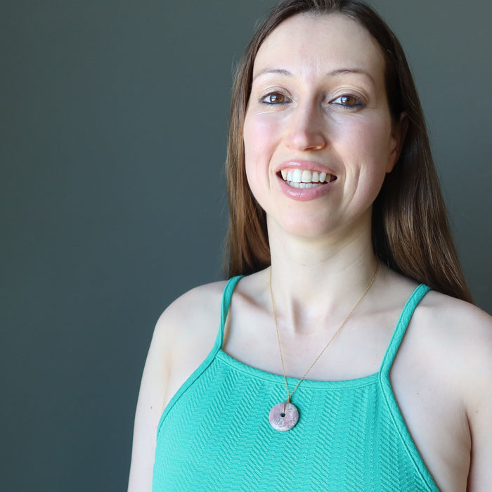 female model wearing pink jasper donut necklace