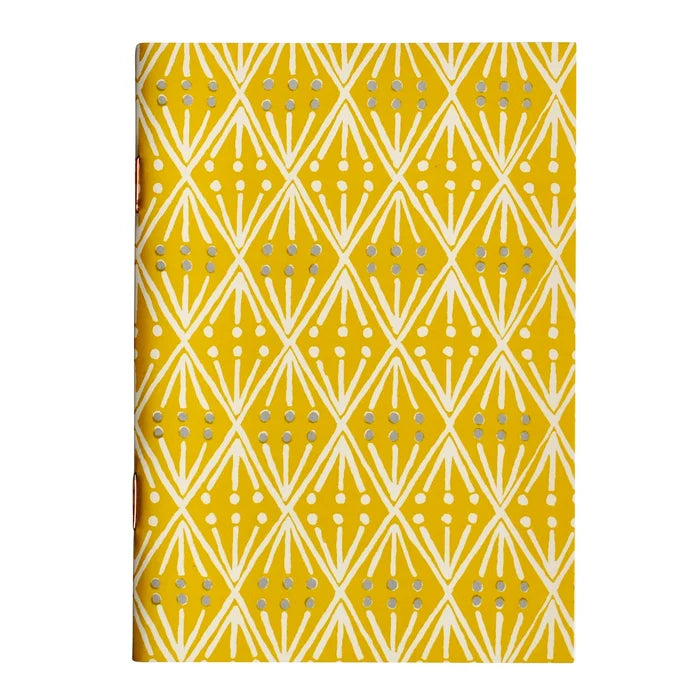 Notebook with geometric pattern on a yellow background