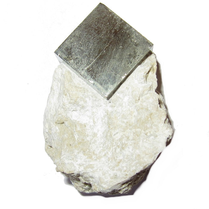 A natural cube of pyrite grows in rock matrix