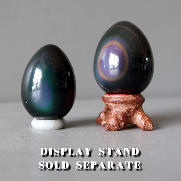 rainbow obsidian eggs on display stands
