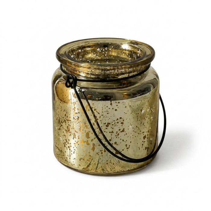 A single gold mercury glass jar with a black wire handle on a solid white background